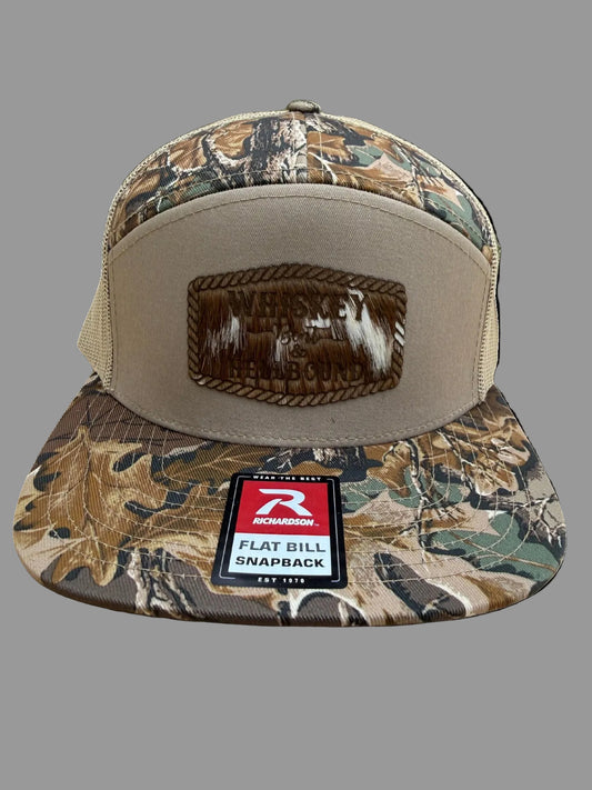Camouflage flat bill hat featuring a leather Whiskey Bent Hellbound patch on a gray background, Hollarwood Outfitters