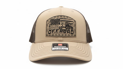 Khaki and chocolate‑brown trucker hat with a leather ‘Life Is Better Off Road’ patch on a white background, Hollarwood Outfitter