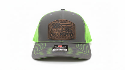 Gray and green trucker hat featuring a leather Off Road patch on a white background, Hollarwood Outfitters