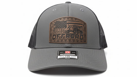 Gray trucker hat featuring a leather Off Road patch on a white background, Hollarwood Outfitters